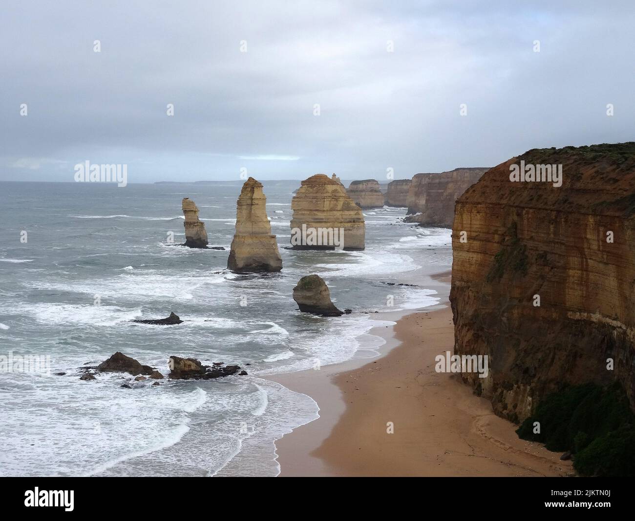 The 12 Apostles limestone stacks off the shore by the Great Oceans Road, Australia Stock Photo