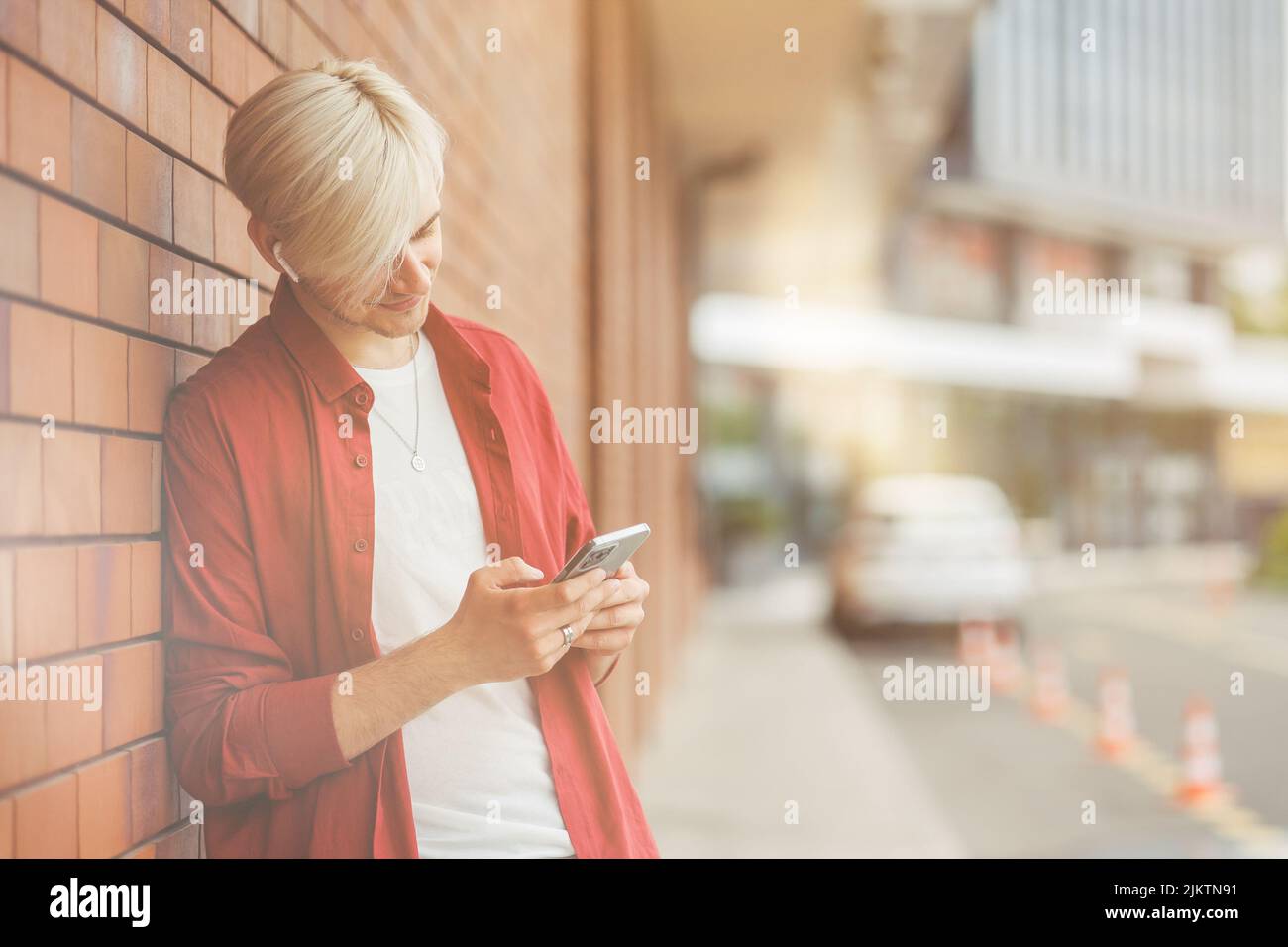Young guy looking at his smart phone. Stock Photo