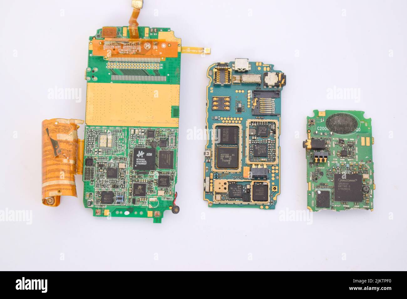 A closeup of a mobile phone mainboard components containing gold Stock Photo