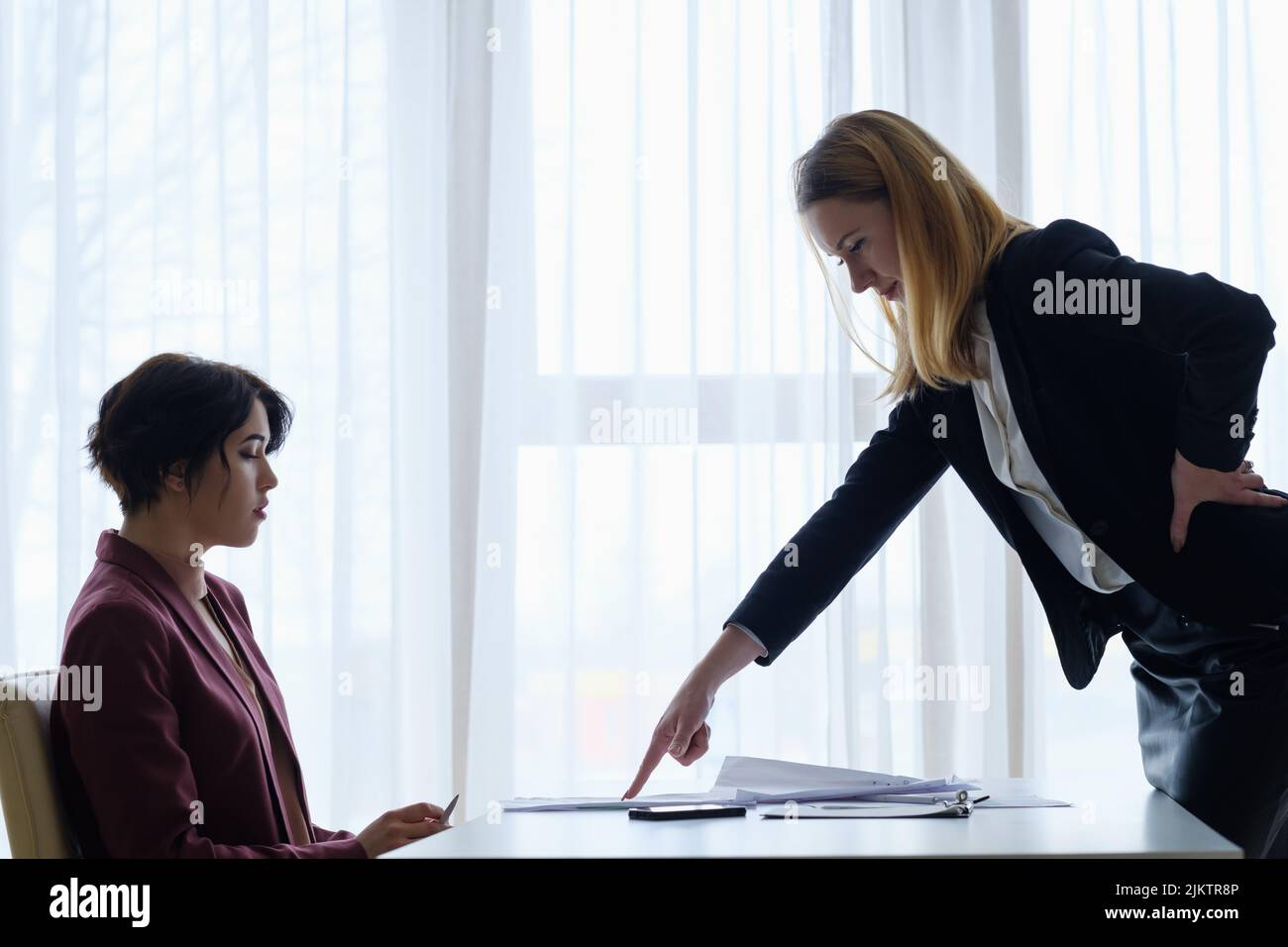 boss scold employee business woman reproof Stock Photo