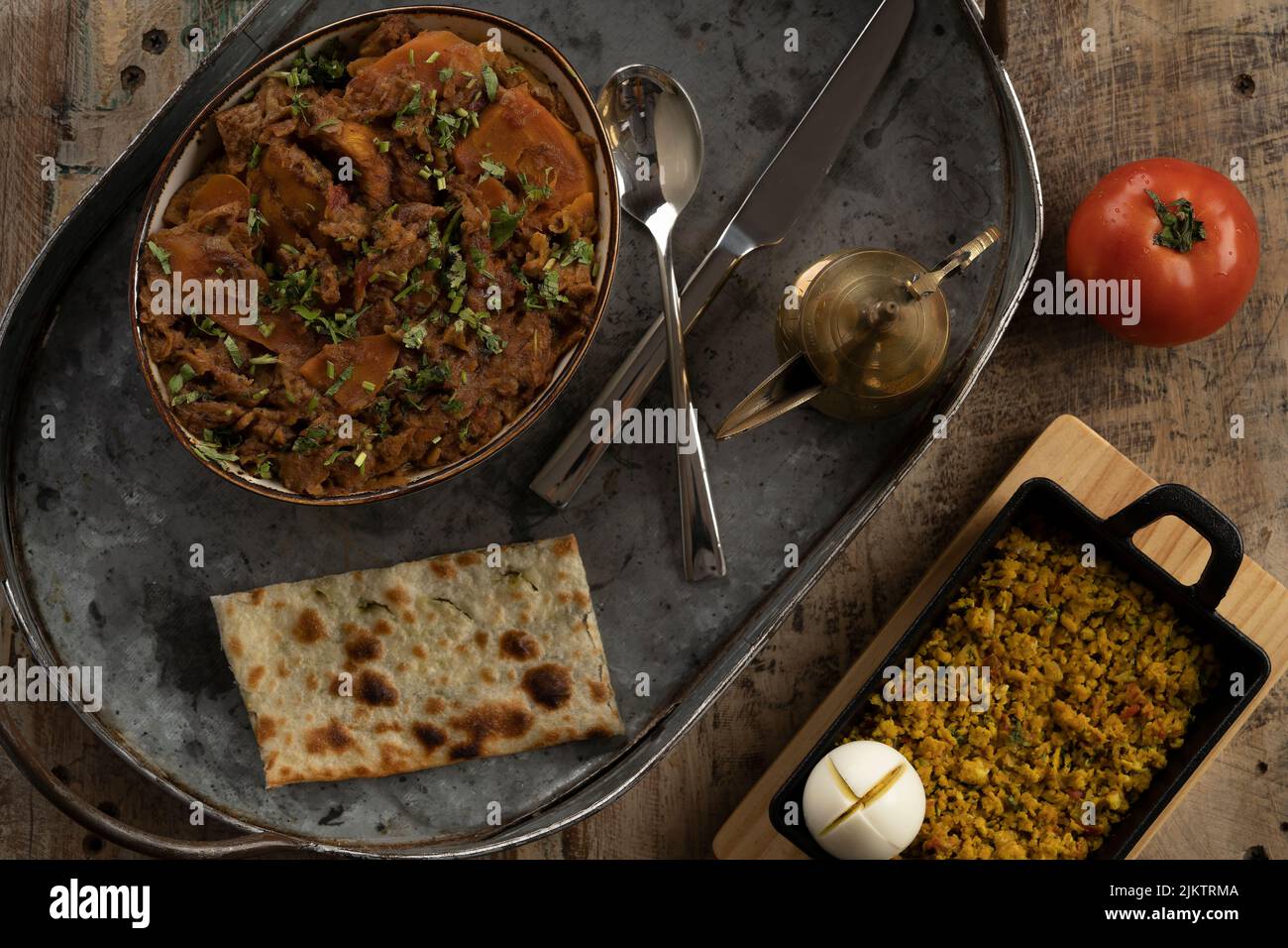 A top view of an Arabic lunch on a metal tray on a table Stock Photo
