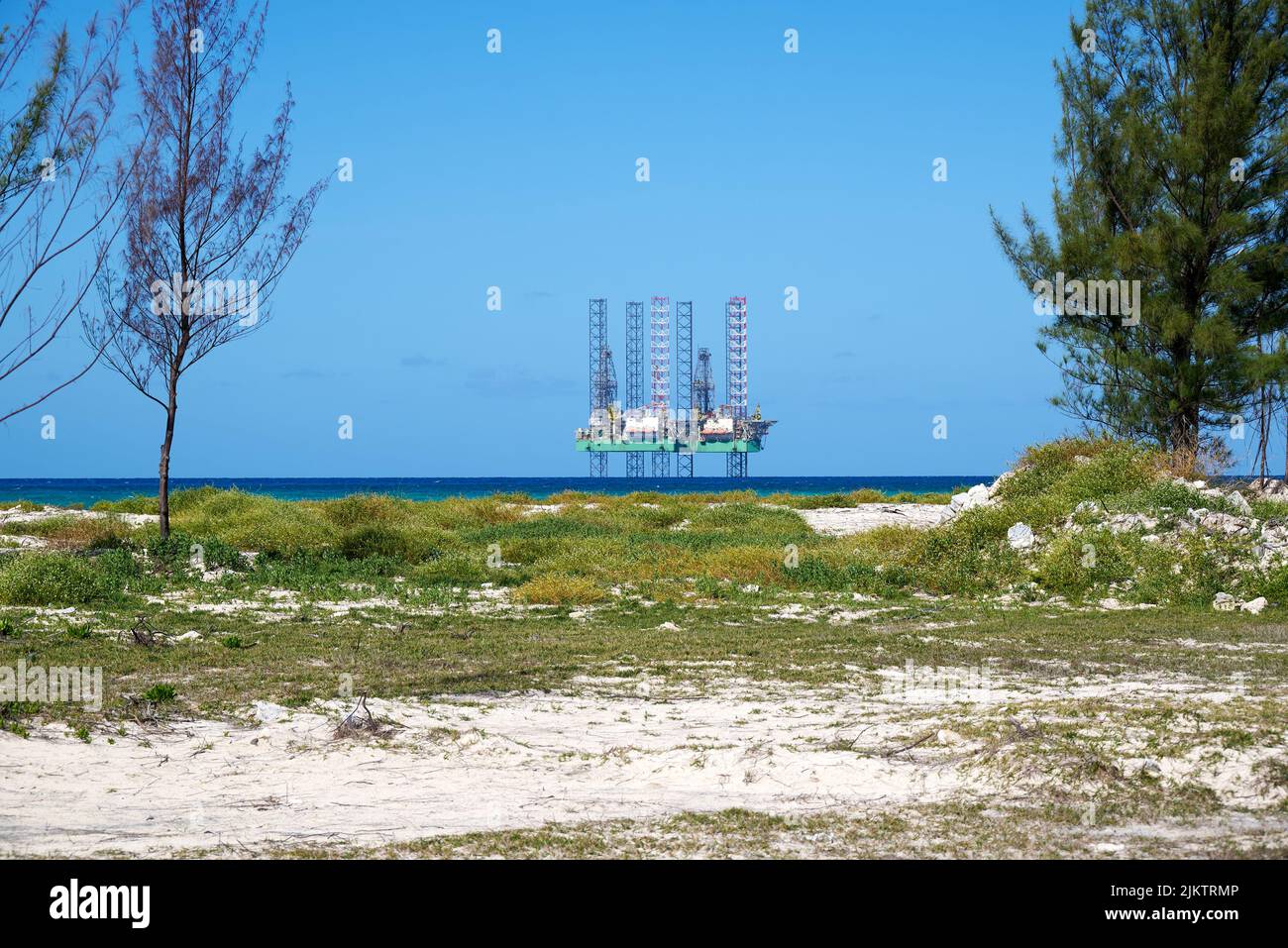 The offshore oil drilling rig platform shot taken from a beach Stock Photo