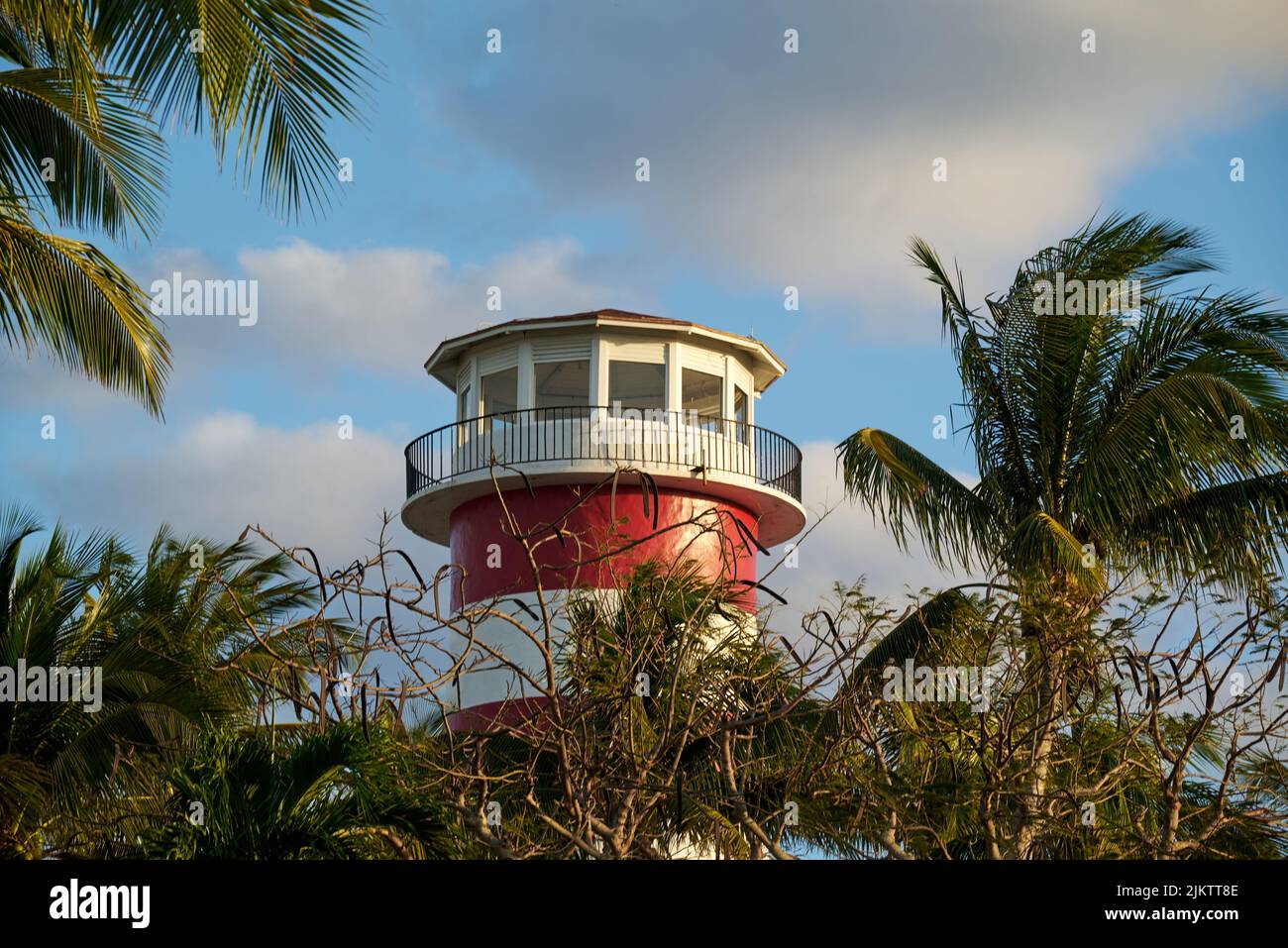 A low angle shot of a white and red lighthouse with a round cupola Stock Photo Alamy