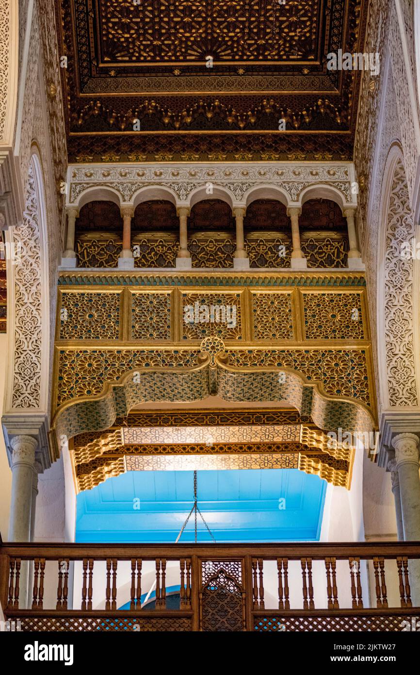 Traditional ornamented arch and balcony inside old building in Sidi Bou Said, Tunis Stock Photo