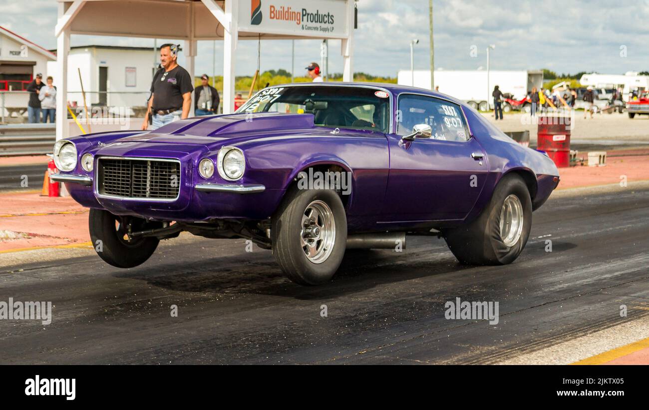 dragster launching at the start of a drag race at Gimli motor sports