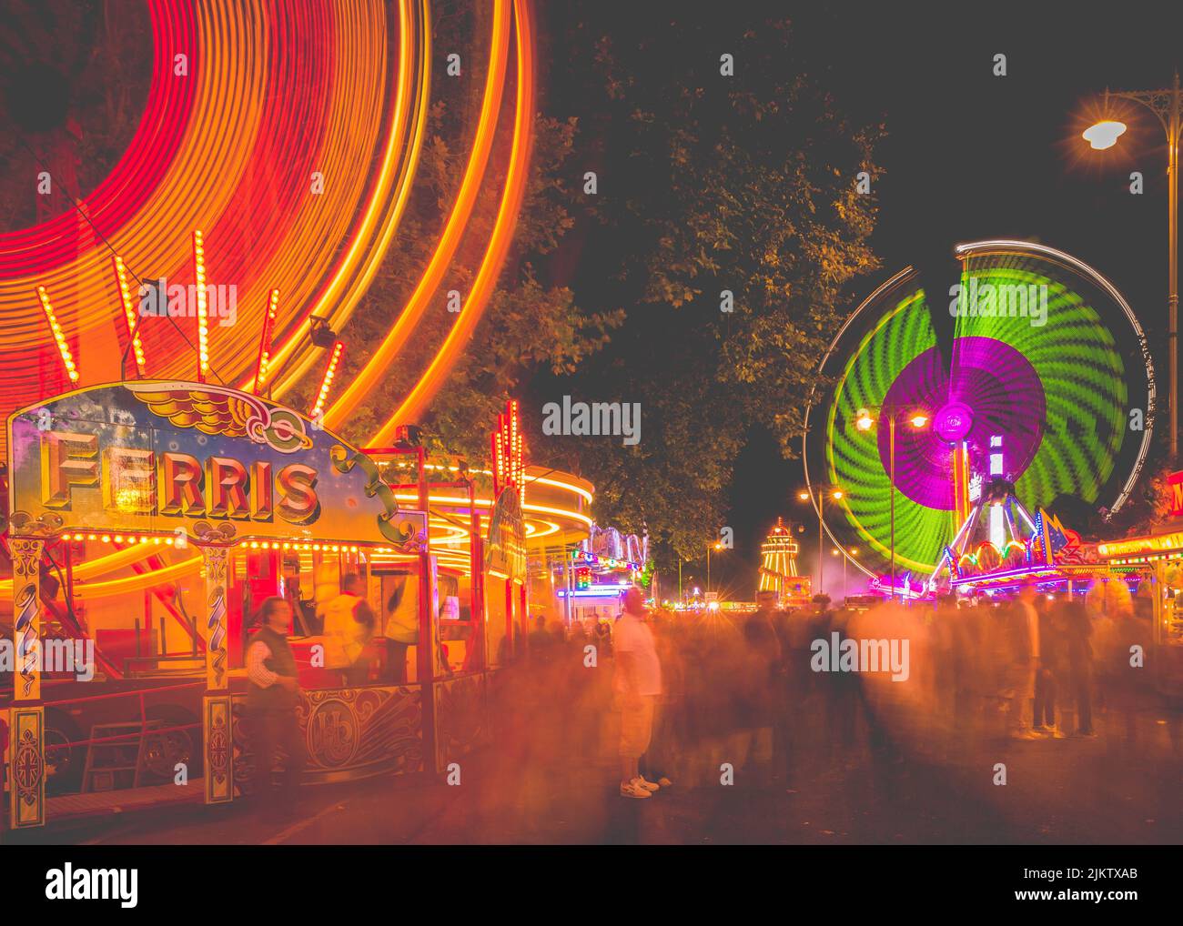 The illuminated moving rides at the St Giles Fair in Oxford at night