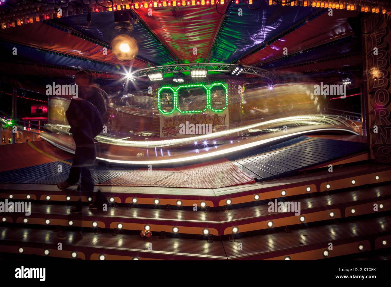 The illuminated light trails from rides at the St Giles Fair, Oxford