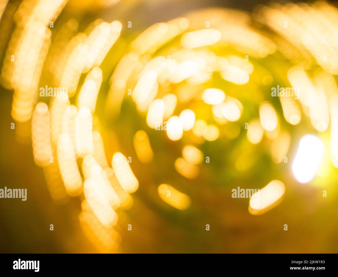 A blurred bokeh yellow and green background, wallpaper Stock Photo
