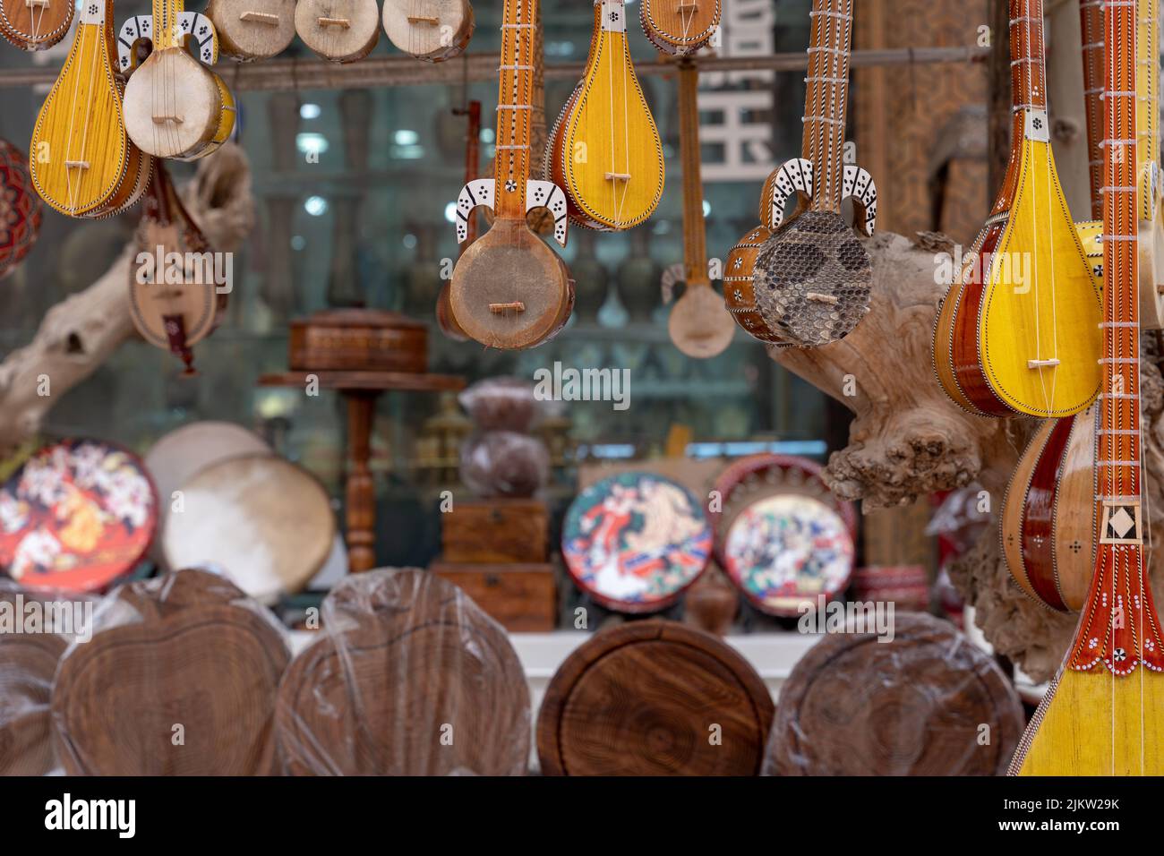 A beautiful shot of string instruments hanging in a music store Stock Photo
