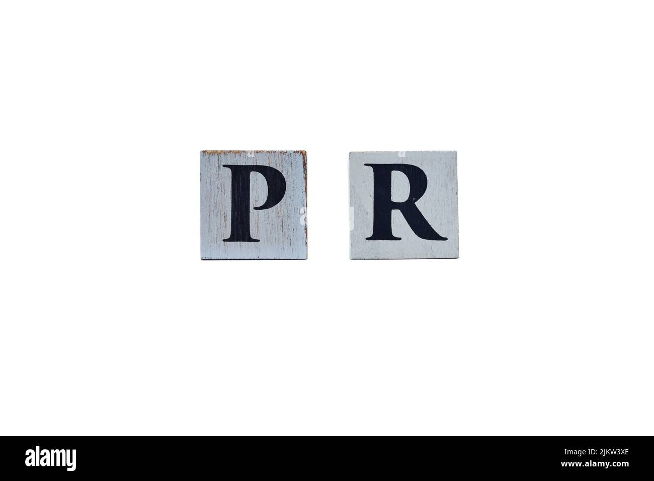 Wooden cubes showing the abbreviation PR for Public Relations on white background, for designs and layouts Stock Photo