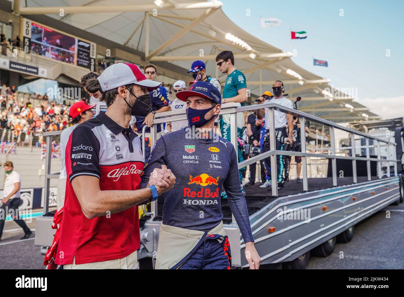 A colleague congratulating Max Verstappen on the victory in Formula 1 Grand Prix, Abu Dhabi Final 2021, UAE Stock Photo