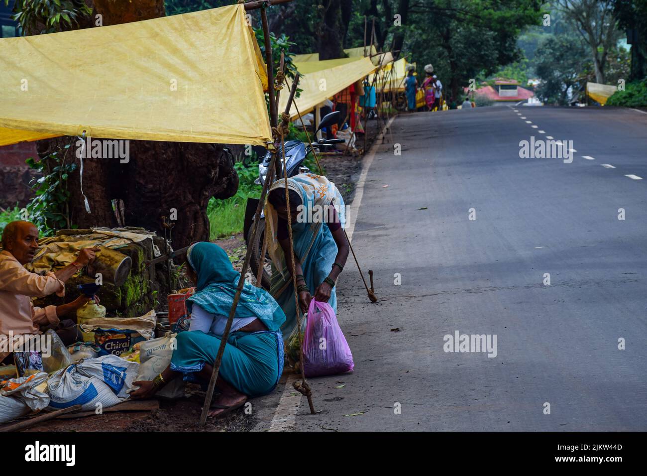 Kolhapur ,India- September 15th 2019; stock photo of 50 to 60 age group Indian women wearing saree buying groceries from street vendor in village week Stock Photo