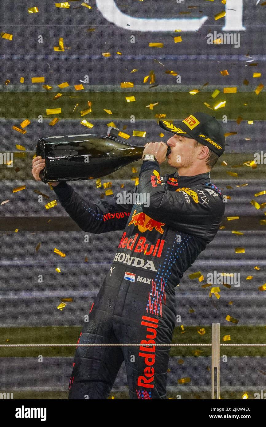 The famous Max Verstappen drinking champagne while celebrating his victory at Formula 1 Grand Prix, Abu Dhabi Final 2021, UAE Stock Photo