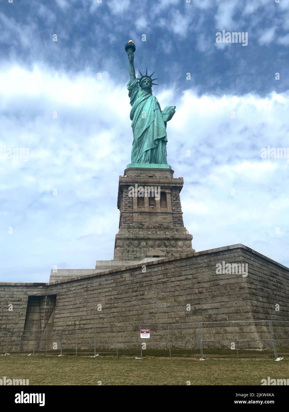 A vertical shot of the Statue of Liberty in New York City, in the ...