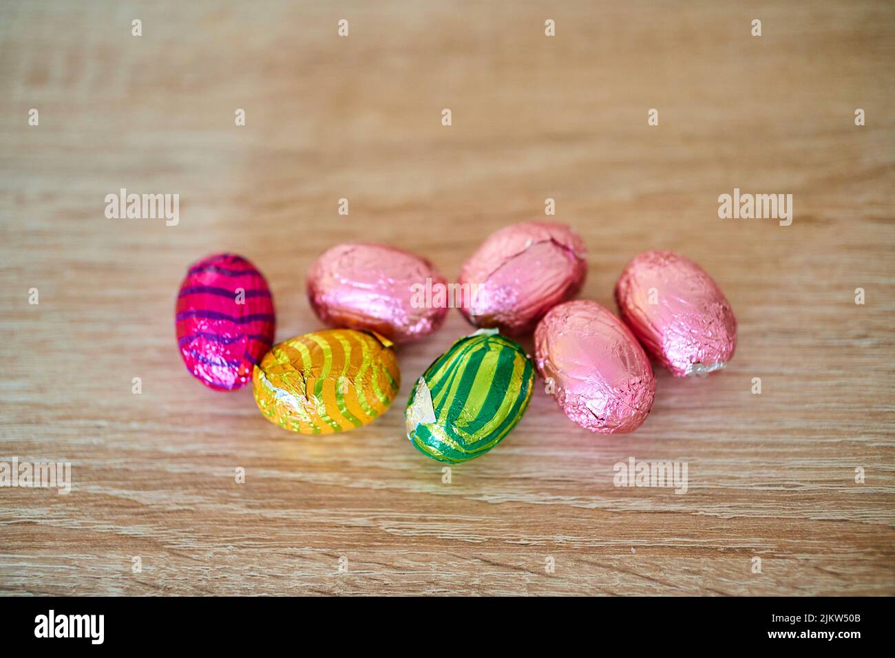 Small Easter chocolate eggs packed in colorful foils Stock Photo