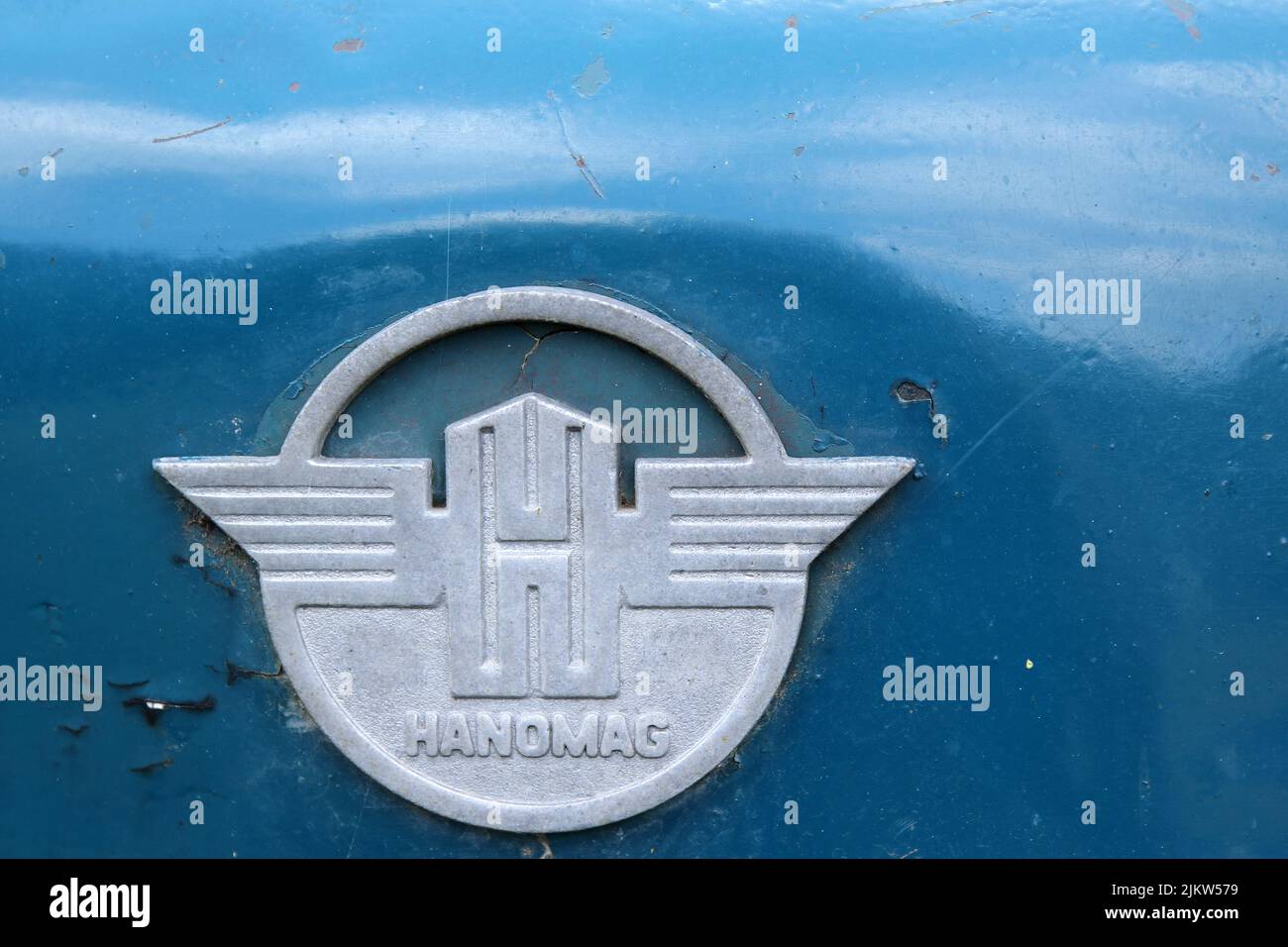 Hanomag was a German agricultural machinery manufacturer from Hanoverit sits on a blue sheet of a tartor and is a close up shot Stock Photo