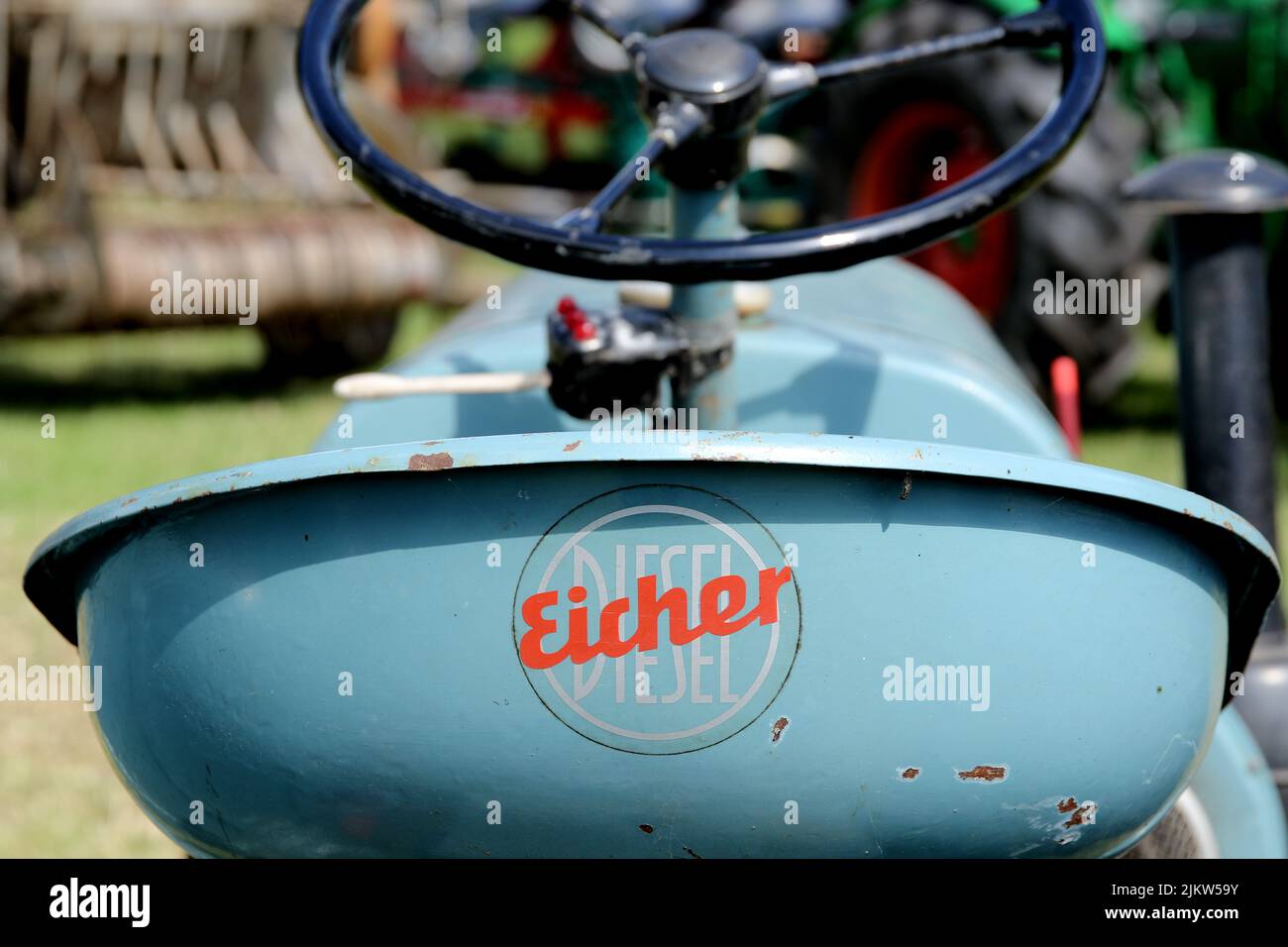 Eicher was a German manufacturer of agricultural machinerythe logo is attached to the seat of the tractor Stock Photo