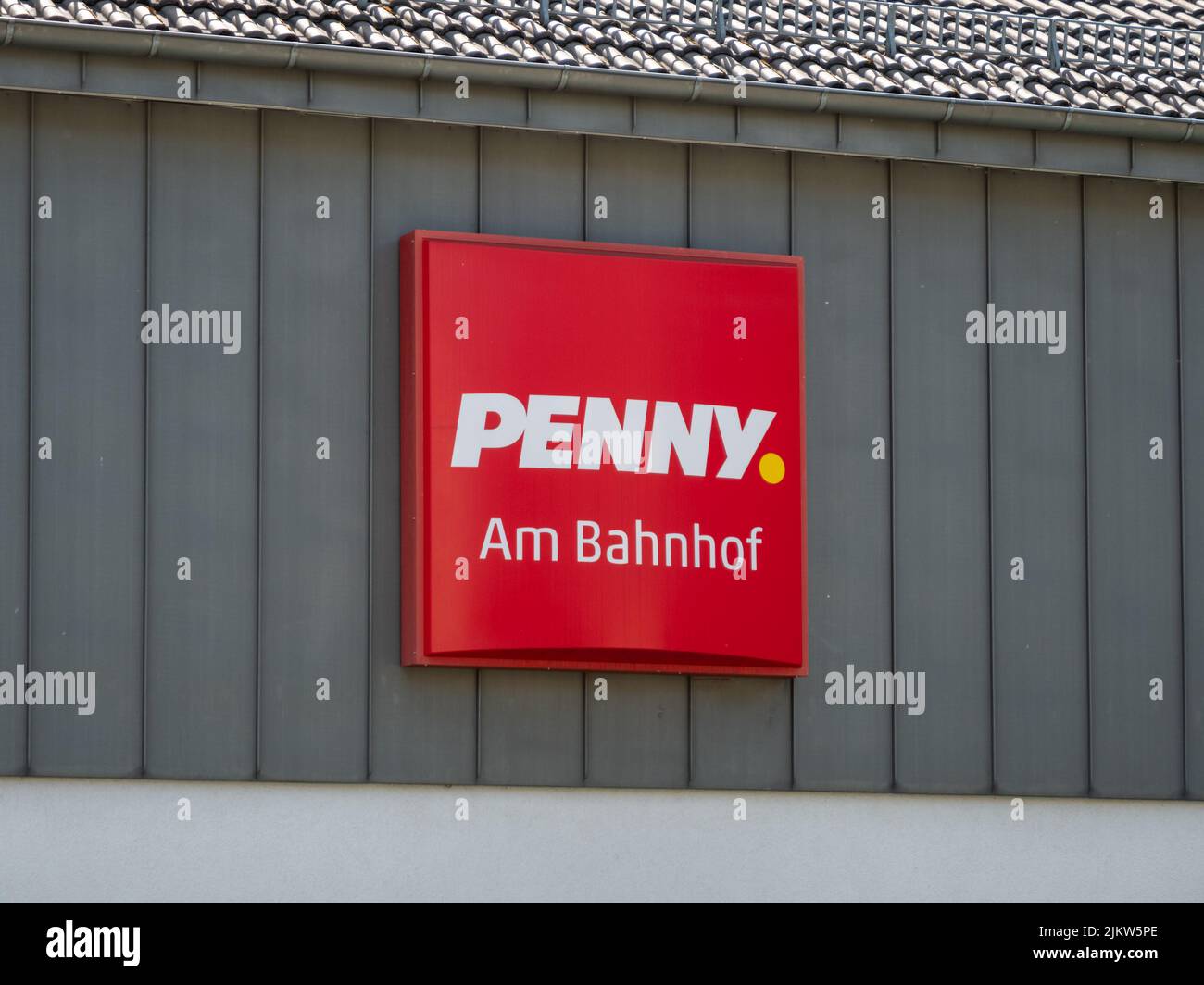 Penny supermarket logo on a building facade. A groceries store next to