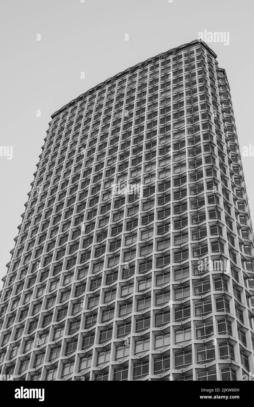 A vertical grayscale low angle shot of a tall modern building in London, UK Stock Photo
