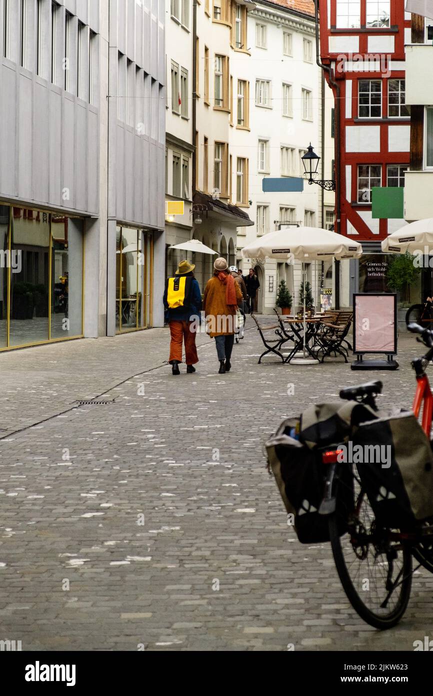 A vertical shot of people walking on the street of Saint Gallen, Switzerland Stock Photo