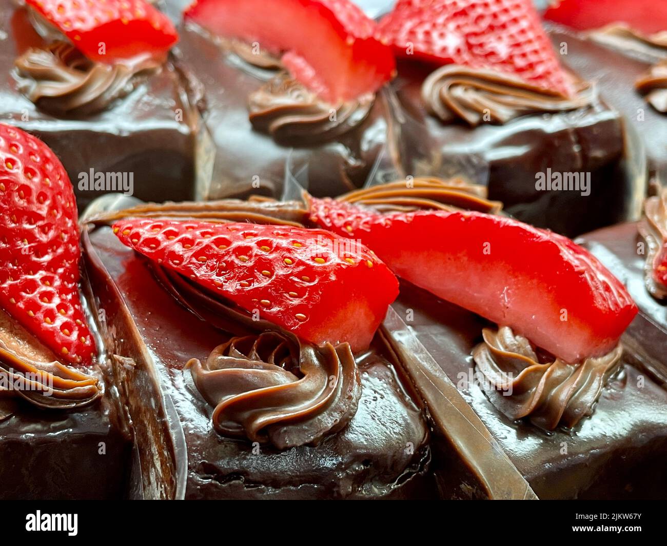 A closeup shot of delicious chocolate piece sweets with strawberries Stock Photo