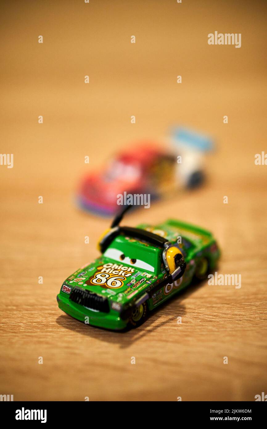 The Chick Hicks Mattel brand toy car from the Disney Pixar Cars movie on a wooden table Stock Photo