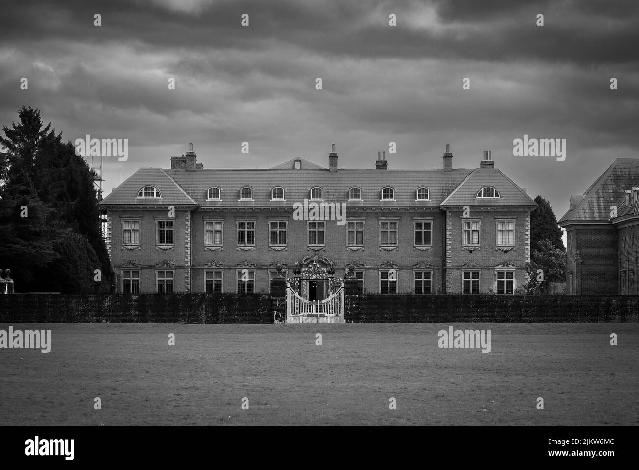 A beautiful shot of Tredegar House on a gloomy day in Newport, South Wales in grayscale Stock Photo
