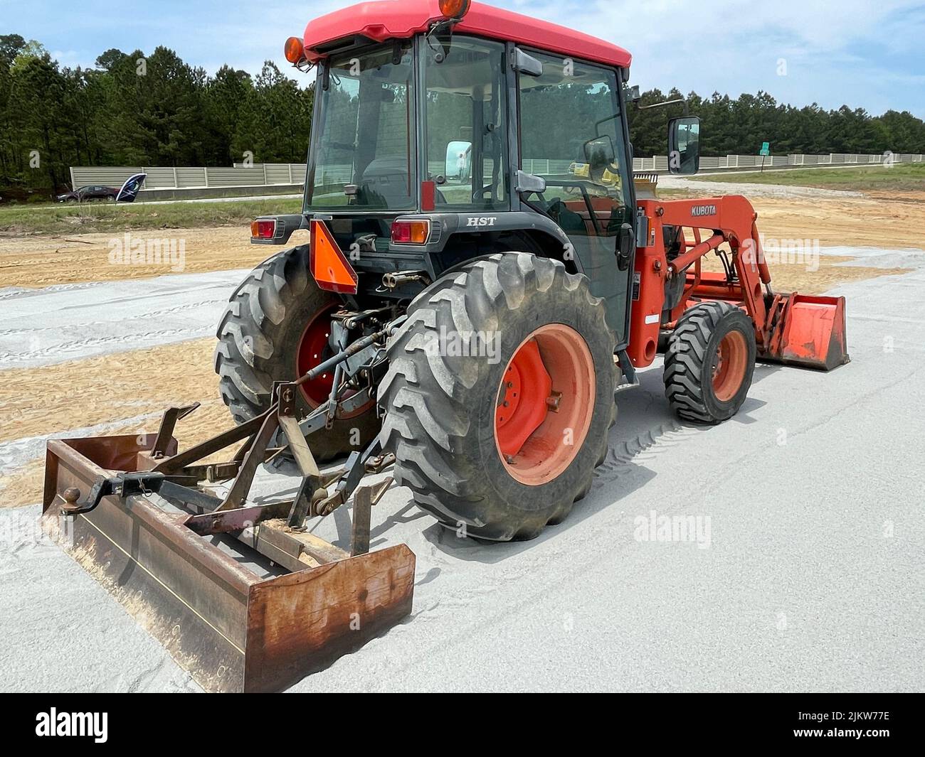 Augusta, Ga USA 04 13 22 Kubota red tractor back corner view Stock