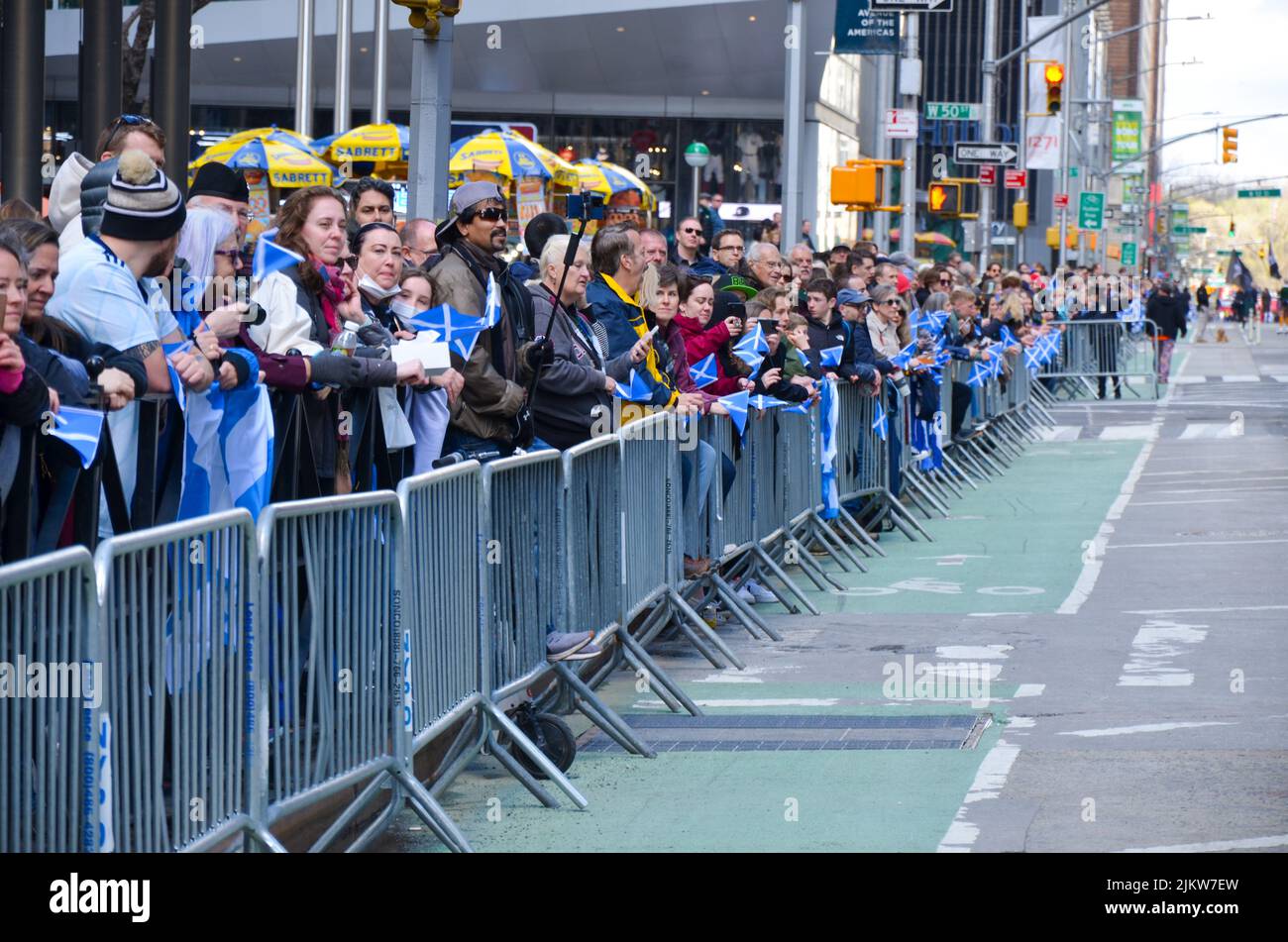 Spectators gathered in Midtown, Manhattan to view the world's largest pipe and drum parade to celebrate Scottish Tartan Day on April 9, 2022 in New Yo Stock Photo