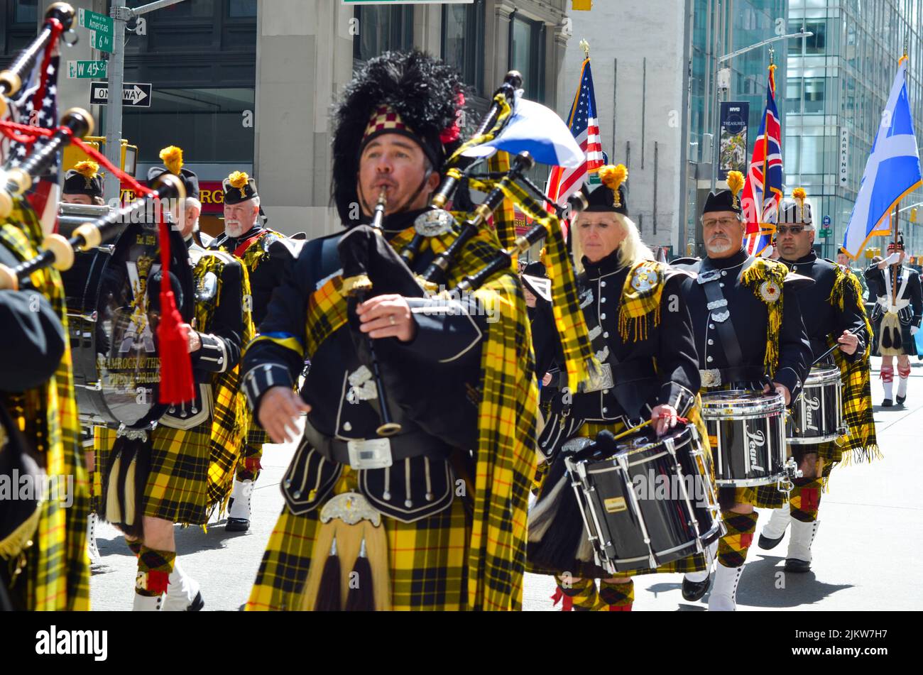 Marching band during the world's largest pipe and drum parade to celebrate Scottish Tartan Day on April 9, 2022 in New York City. Stock Photo