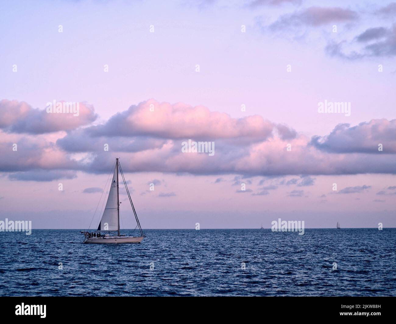 Sailing boat at sunset hi-res stock photography and images - Alamy
