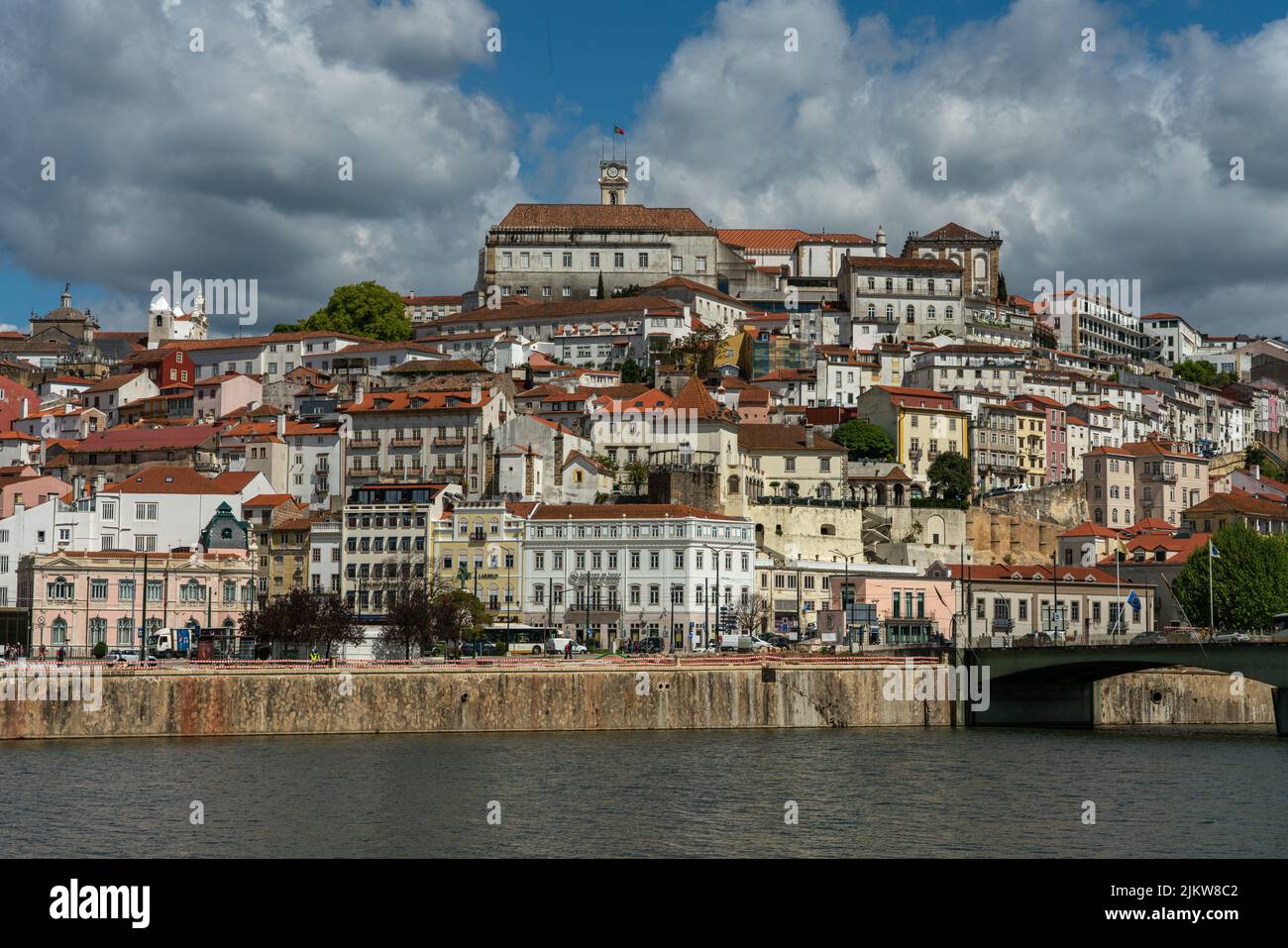 The Coimbra city view with Mondego river and historic buildings in