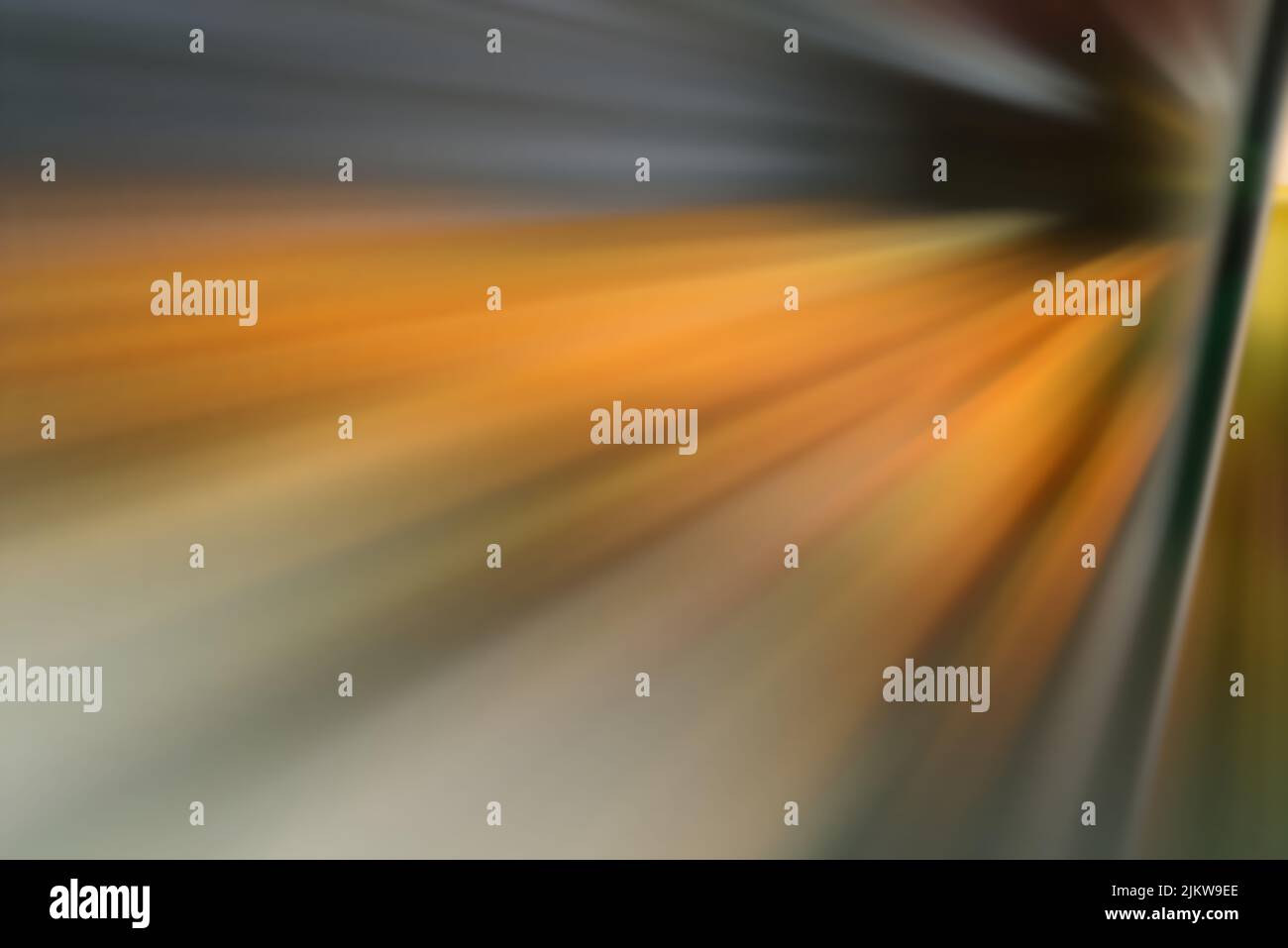 A blurry explosion of sparkles in gray and orange tones Stock Photo