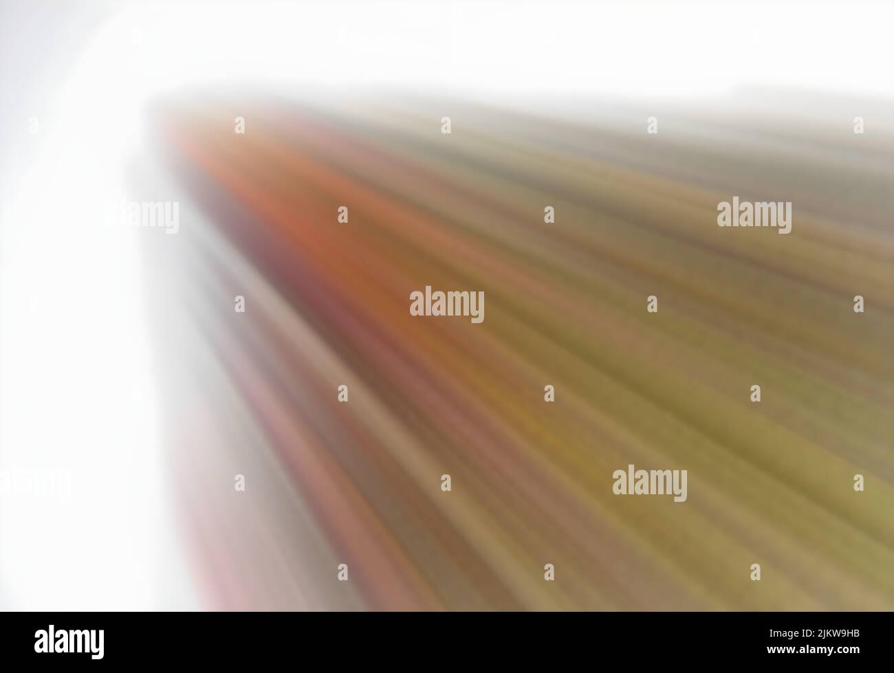 A bright explosion of colorful rays from the left angle of blurry ...