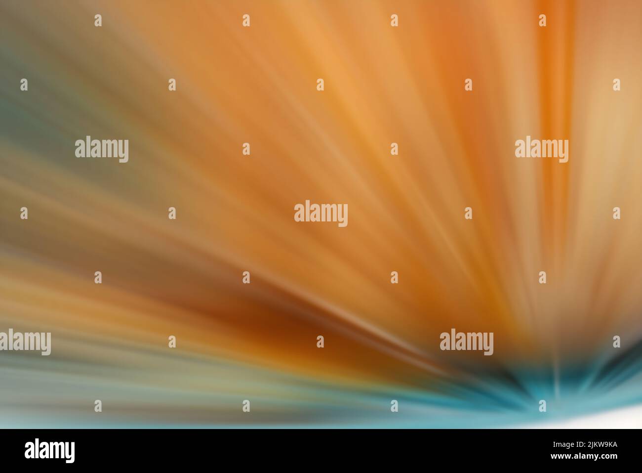 A dynamic texture of orange starburst with sparkles Stock Photo