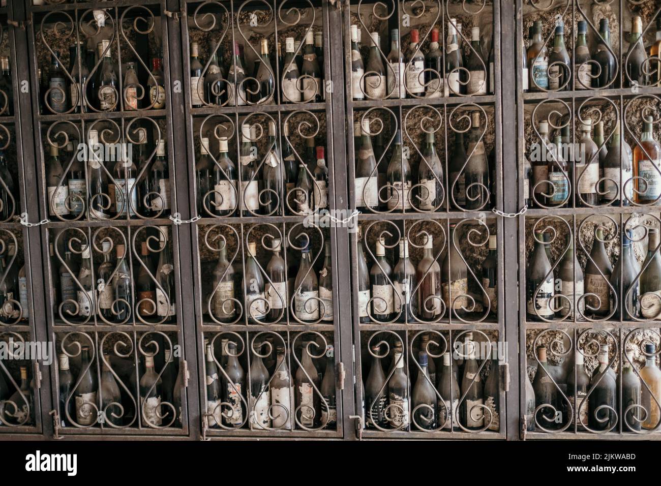 A closeup of old wine bottles on a vintage shelf Stock Photo