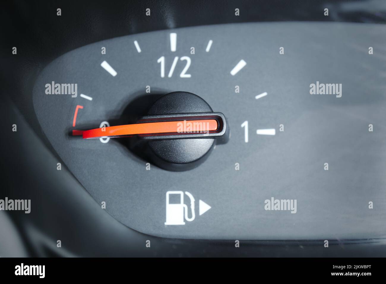 Close up of a fuel gauge showing an empty fuel tank in a car. Transportation with fossil fuel