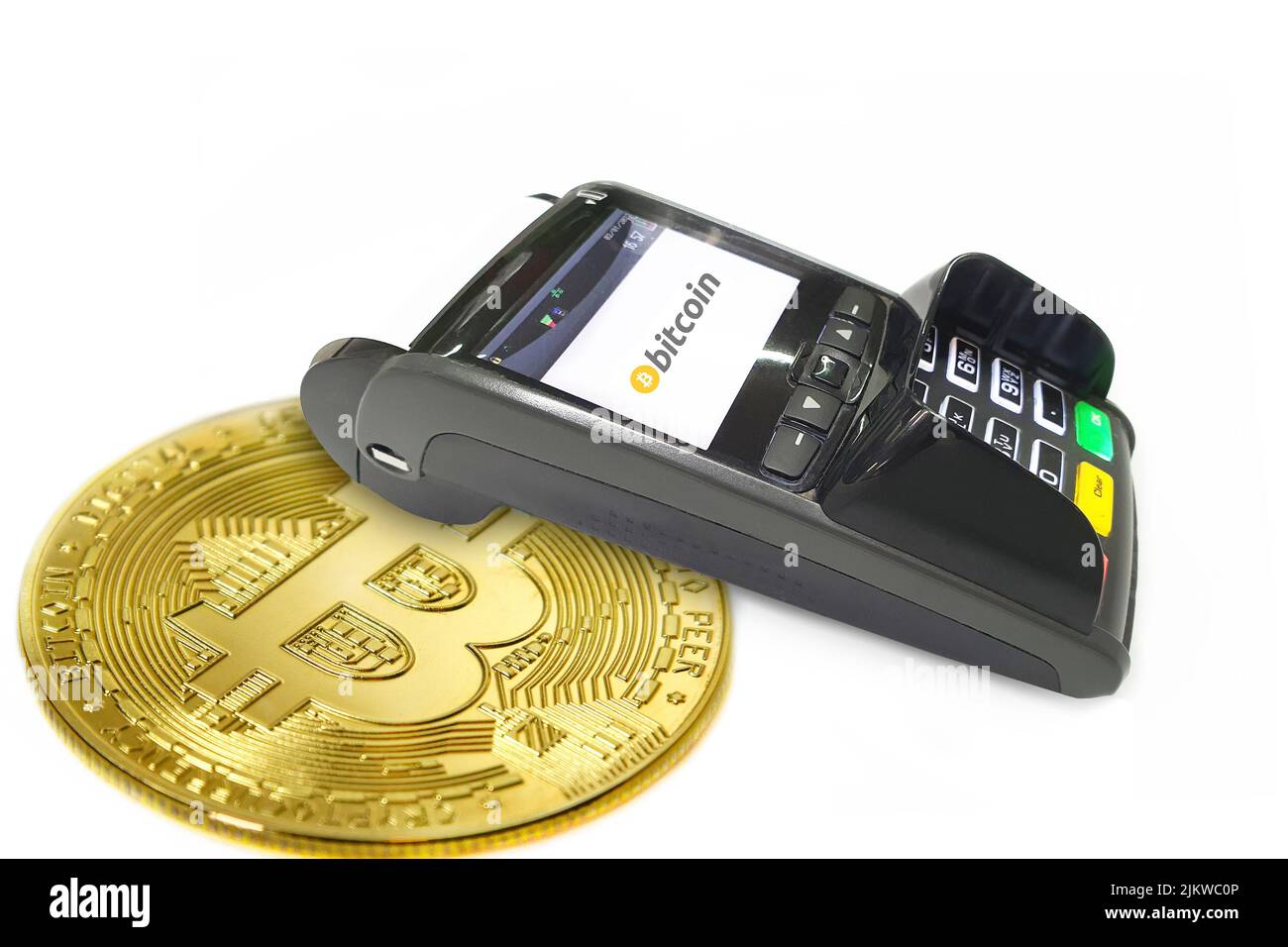 A POS terminal for bitcoin payments isolated on a white background Stock Photo