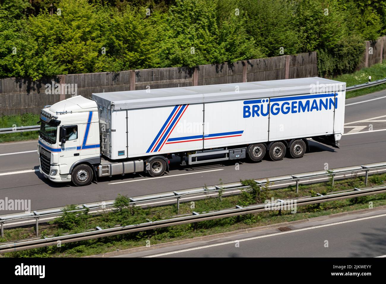Brüggemann DAF XF truck with bulk trailer on motorway Stock Photo