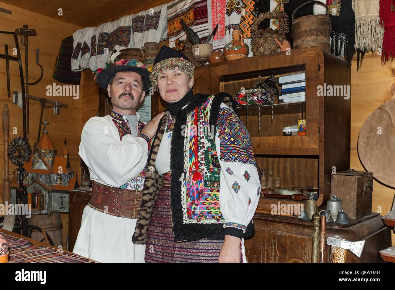 Man and woman in Ukrainian Hutsul costumes show the old traditional Hutsul way of life in Yaremche Ukraine. Stock Photo