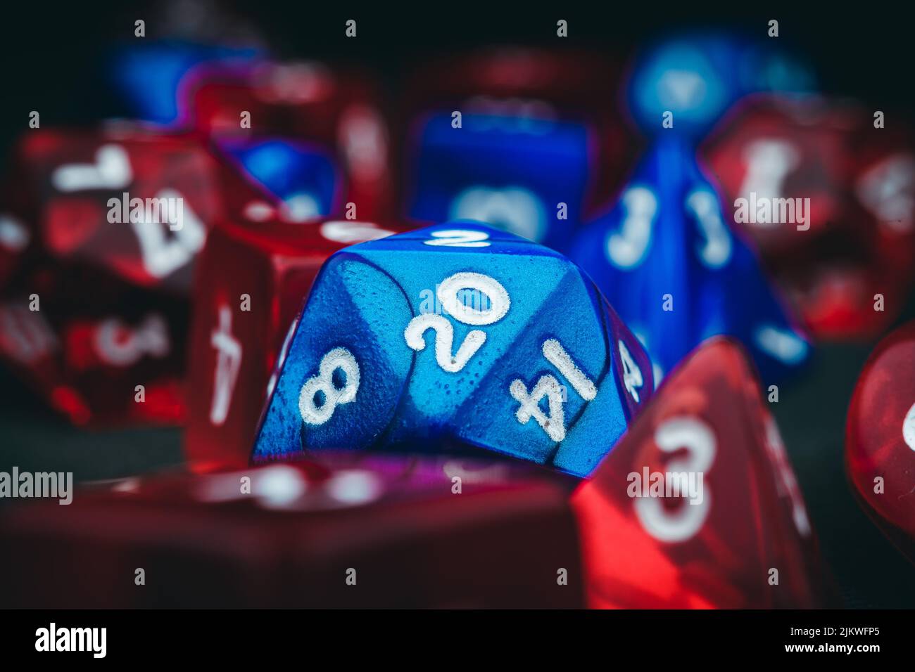 A closeup of blue and red dungeons and dragons dice Stock Photo
