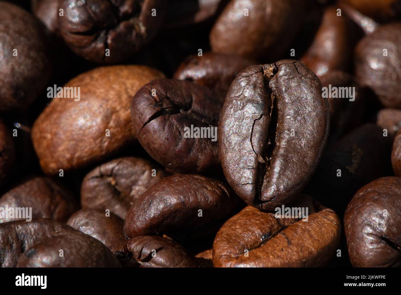 roasted and brown coffee beans background Stock Photo - Alamy