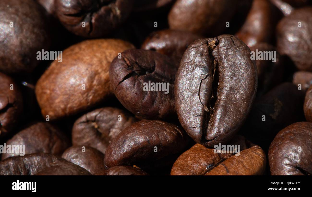 roasted and brown coffee beans background Stock Photo - Alamy