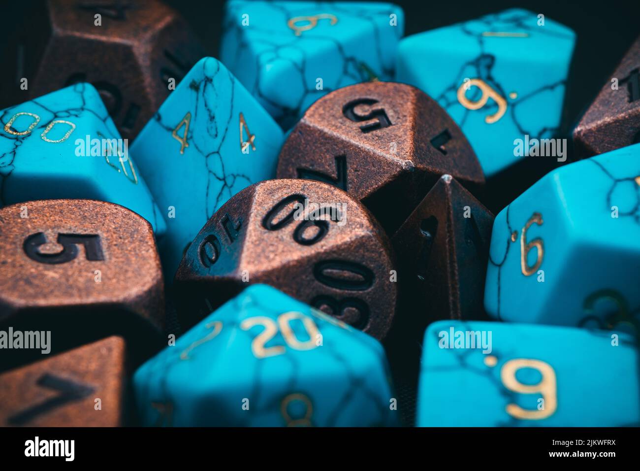 A closeup of brown and turquoise dungeons and dragons dice Stock Photo