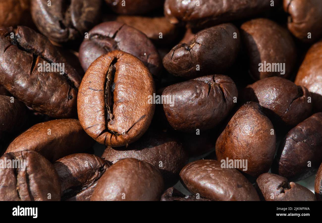 roasted and brown coffee beans background Stock Photo - Alamy