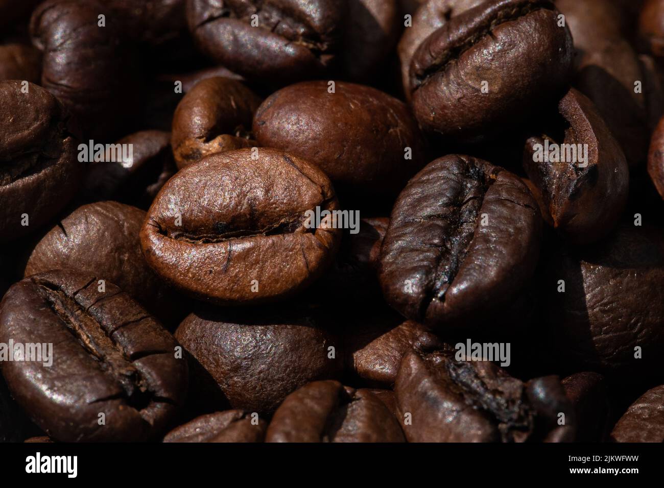roasted and brown coffee beans background Stock Photo - Alamy