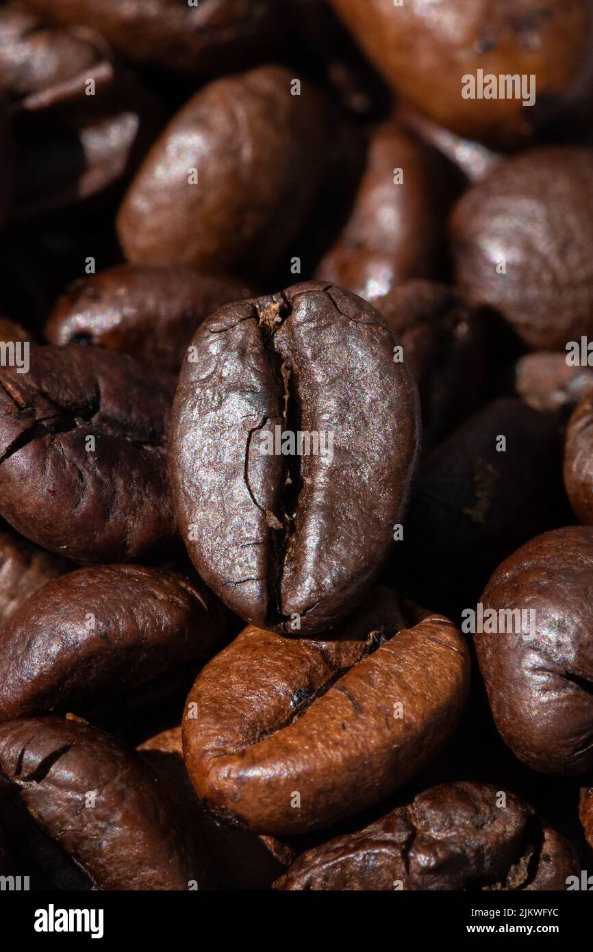 roasted and brown coffee beans background Stock Photo - Alamy