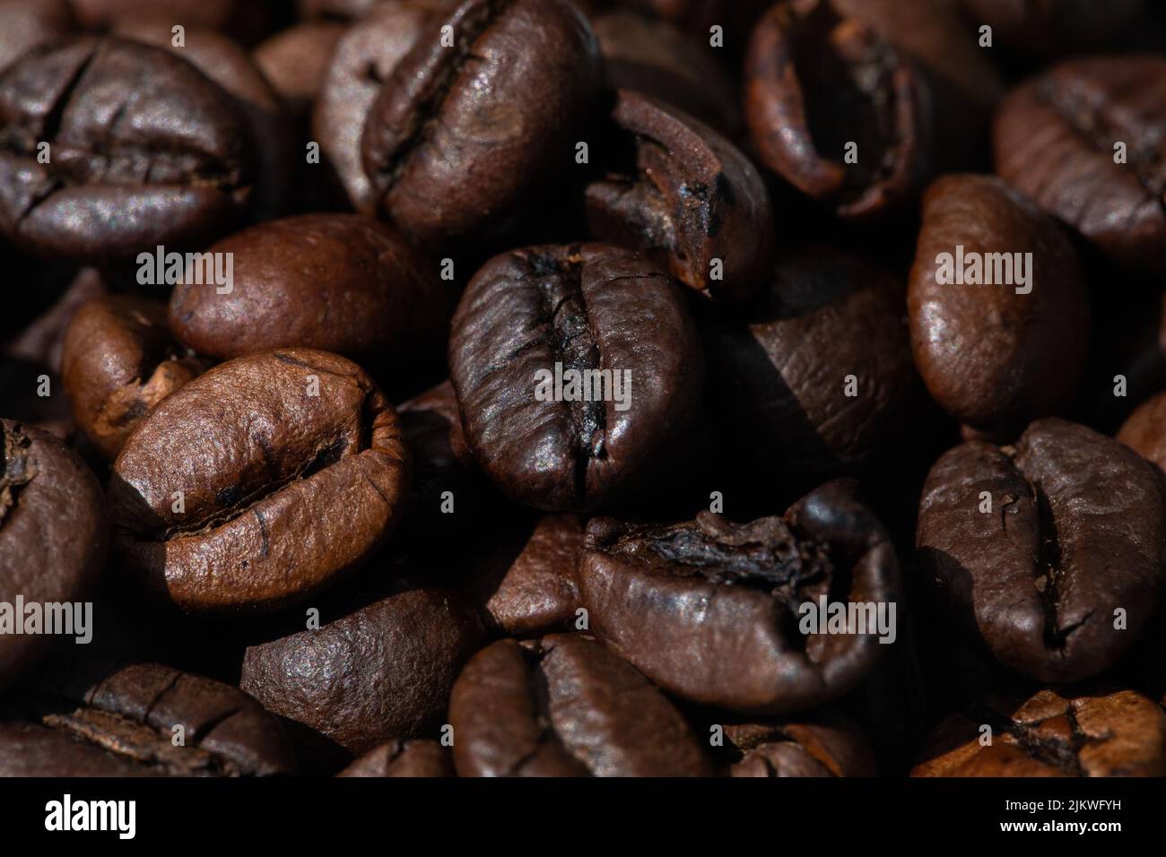 roasted and brown coffee beans background Stock Photo - Alamy