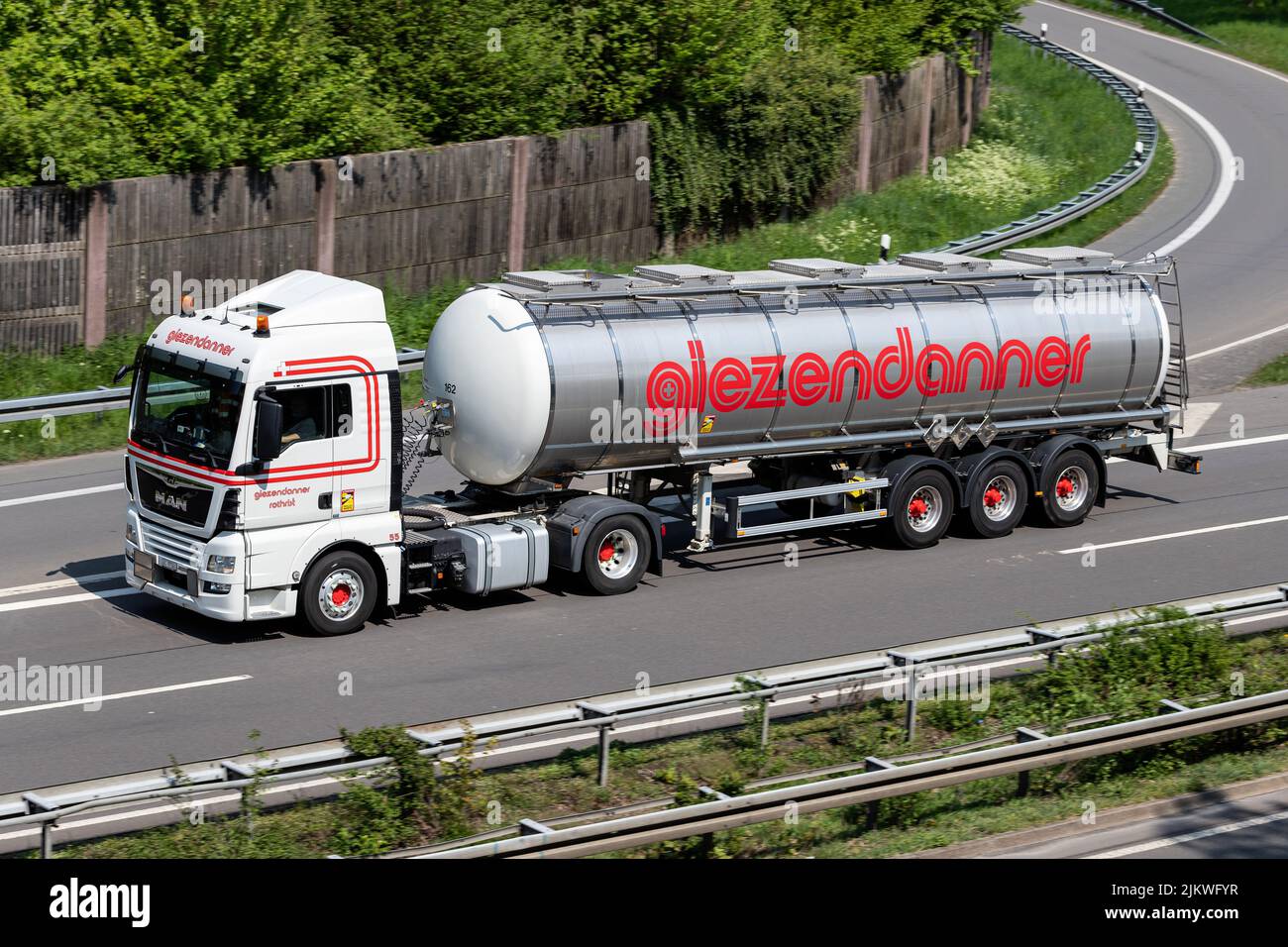 Giezendanner MAN truck with tank trailer on motorway Stock Photo