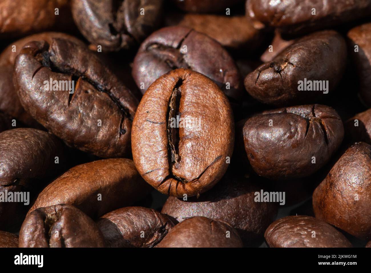 roasted and brown coffee beans background Stock Photo - Alamy